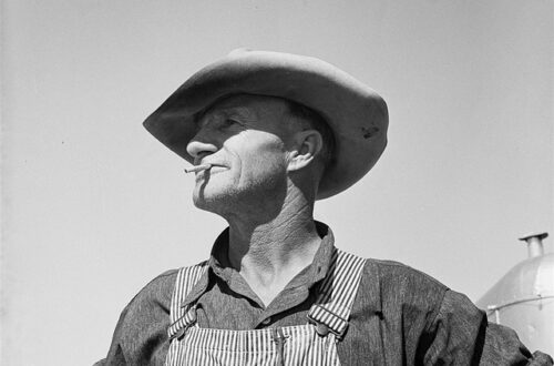 Man in overalls and hat